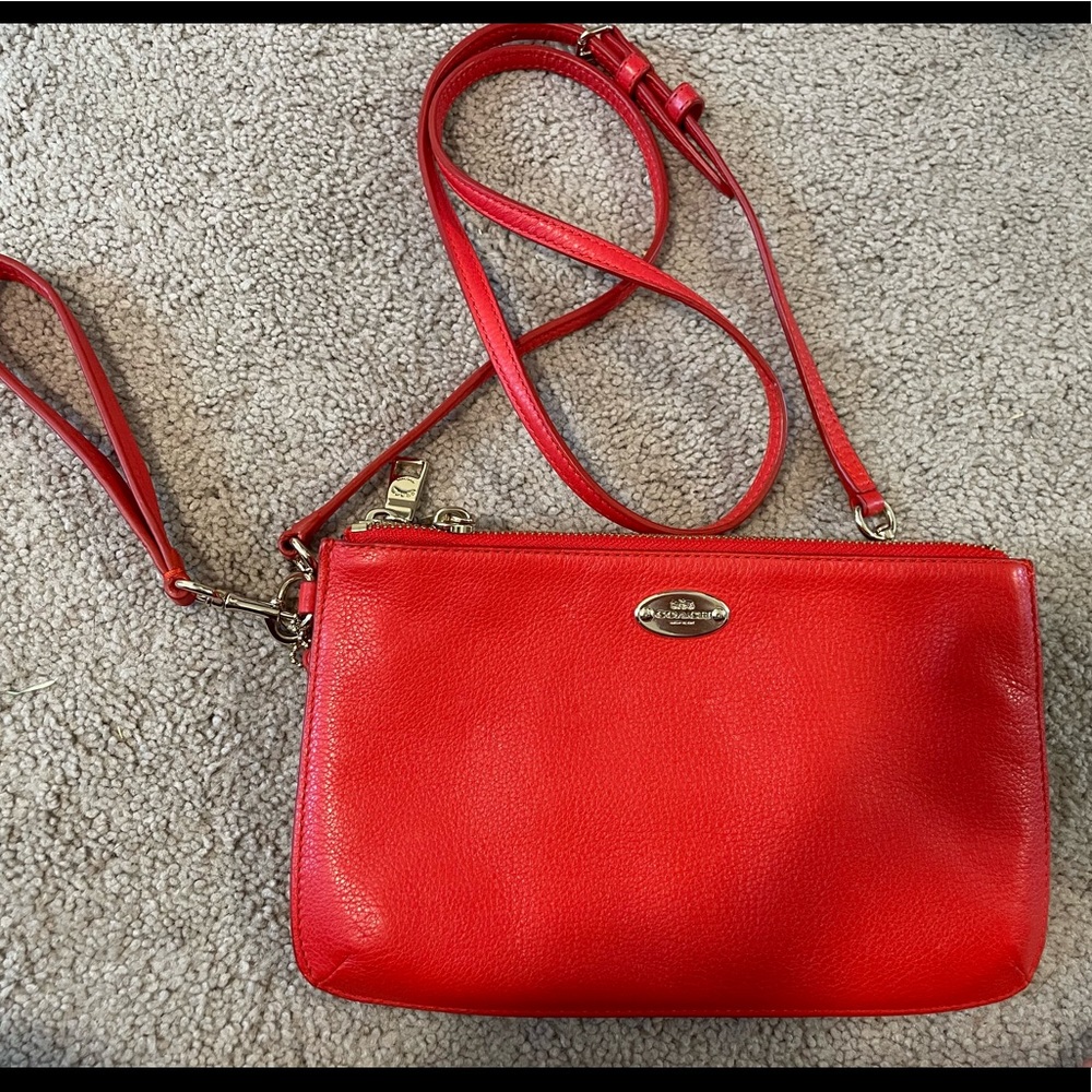 Coach purse/wristlet coral/reddish color GUC